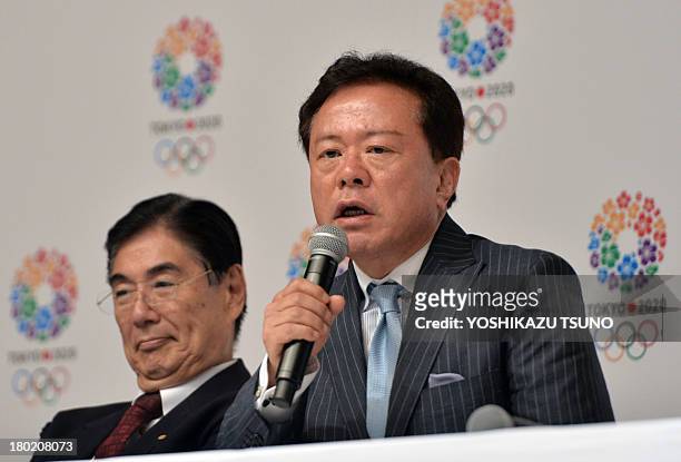 Tokyo Governor Naoki Inose speaks while Olympic bid committee CEO Masato Mizuno looks on during a press conference at the Tokyo city hall on...