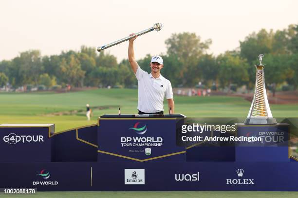 Nicolai Hojgaard of Denmark lifts the DP World Tour Championship trophy on the 18th green during Day Four of the DP World Tour Championship on the...