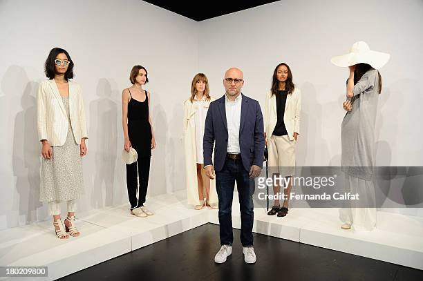 Designer Steven Alan poses with models on the runway at the Steven Alan presentation during Mercedes-Benz Fashion Week Spring 2014 at The Box at...