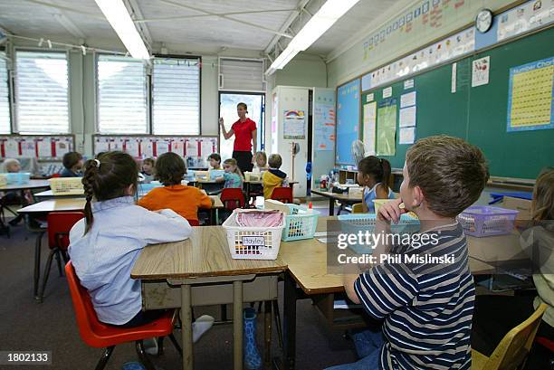 Kindergarten teacher prepares her students for a classroom lockdown drill February 18, 2003 in Oahu, Hawaii. Lockdown procedure is used to protect...