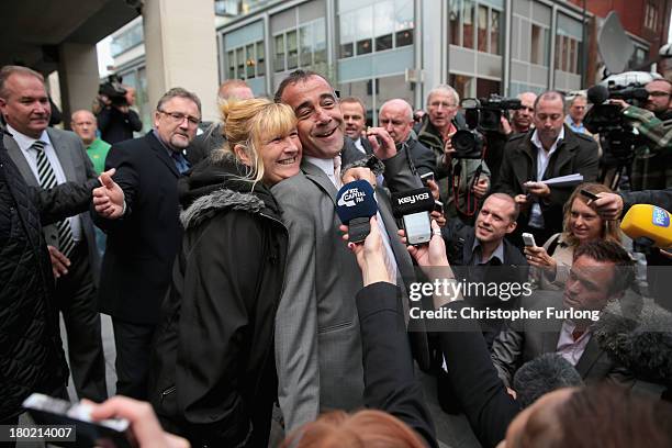 Michael Le Vell, who plays Kevin Webster in the TV soap Coronation Street, is embraced by friends as he makes a statement to the press after being...