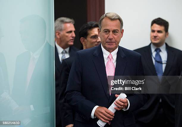 Speaker of the House John Boehner, R-Ohio, arrives to address reporters following the House Republican Conference meeting in the basement of the...