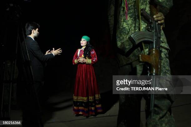 Before the concert, Aryana Sayeed arrives with an escort of soldiers armed with Kalashnikovs that ensure her protection, Aryana poses with...