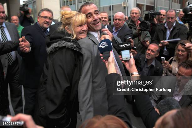 Michael Le Vell, who plays Kevin Webster in the TV soap Coronation Street, is embraced by friends as he makes a statement to the press after being...