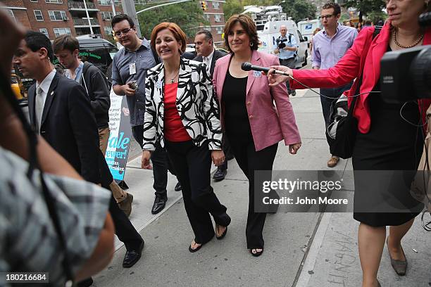 Democratic mayoral candidate Christine Quinn and her wife Kim Catullo depart a polling station after casting their votes in the primary election for...