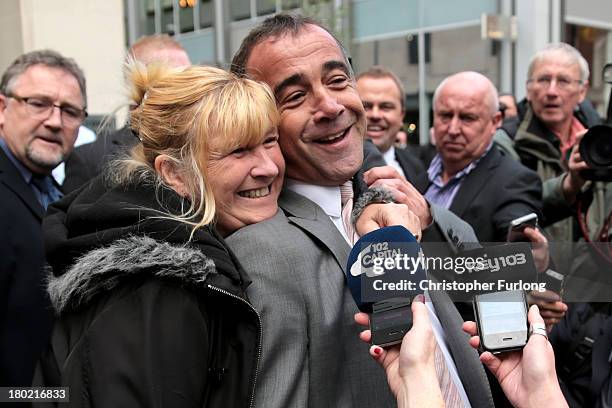 Michael Le Vell, who plays Kevin Webster in the TV soap Coronation Street, is embraced by friends as he makes a statement to the press after being...