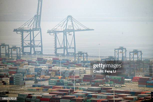 Shipping containers sit stacked at Port of Dalian on September 10, 2013 in Dalian of Liaoning Province, China. China's exports rose 7.2 percent year...