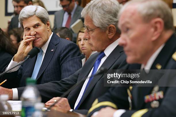 Secretary of State John Kerry, Secretary of Defense Chuck Hagel and Chairman of the Joint Chiefs of Staff Gen. Martin Dempsey testify before the...