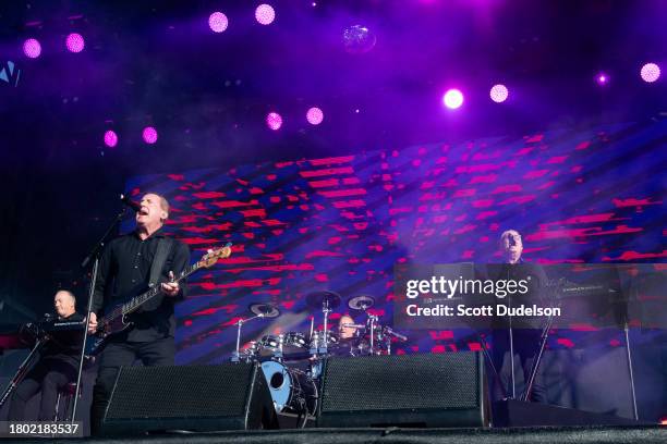 Singers Martin Cooper, Andy McCluskey and Paul Humphreys of Orchestral Manoeuvres in the Dark performs onstage during The Darker Waves Festival on...