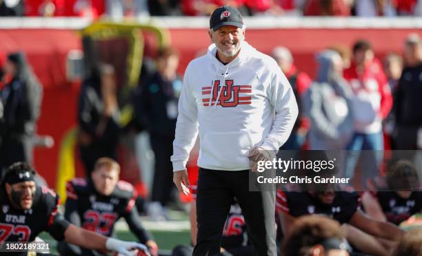Kyle Whittingham head coach of the Utah Utes walks through the players during warmups before their game against the Colorado Buffaloes at Rice Eccles...