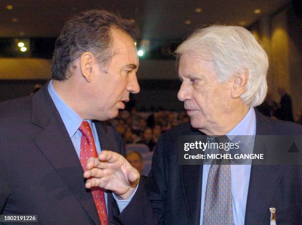 President of French party UDF François Bayrou speaks with writer and former Spanish Culture Minister Jorge Semprun 29 October 2004 in the southern...