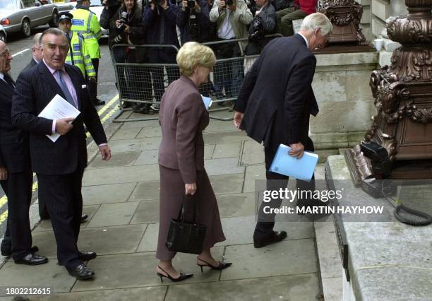 Former top civil servant Lord Robin Butler arrives with Foreign Affairs Committe member Anne Taylor for a press conference on his report into British...