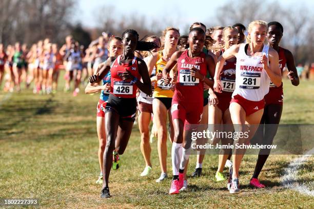 Hilda Olemomoi of the Alabama Crimson Tide and Katelyn Tuohy of the NC State Wolfpack compete during the Division I Men's and Women's Cross Country...