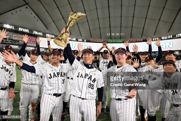 Japan players celebrate after the award ceremony following the Asia Professional Baseball Championship Final between South Korea and Japan at Tokyo...