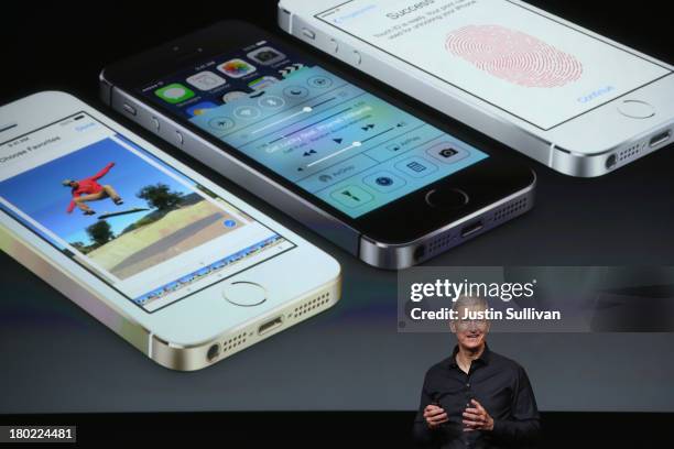 Apple CEO Tim Cook speaks about the new iPhone during an Apple product announcement at the Apple campus on September 10, 2013 in Cupertino,...