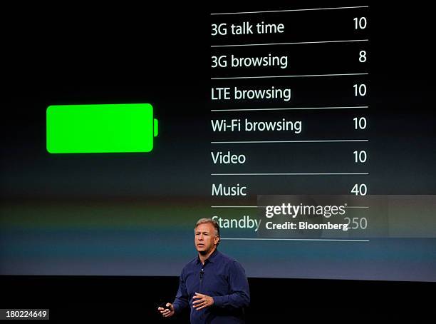 Philip Schiller, senior vice president of worldwide marketing at Apple Inc., introduces a new iPhone 5S during a product announcement in Cupertino,...