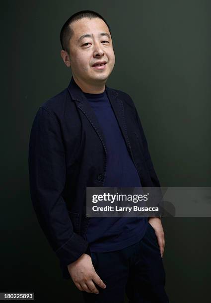 Director Jia Zhangke of 'A Touch Of Sin' poses at the Guess Portrait Studio during 2013 Toronto International Film Festival on September 10, 2013 in...