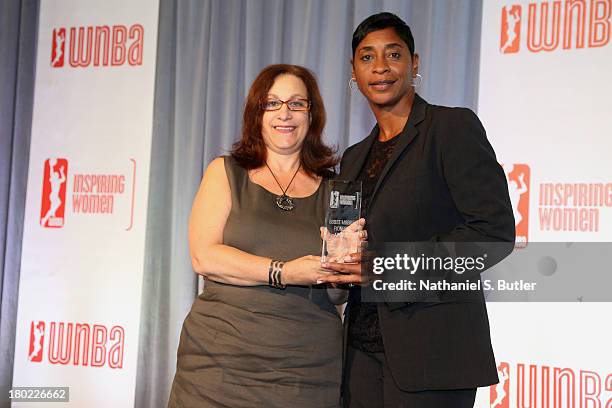 Referee, Violet Palmer poses for a picture after recieving an award at the 2013 WNBA Inspiring Women's Luncheon in New York City. NOTE TO USER: User...