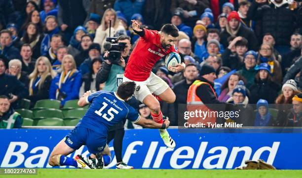 Dublin , Ireland - 25 November 2023; Conor Murray of Munster evades the tackle of Hugo Keenan of Leinster during the United Rugby Championship match...