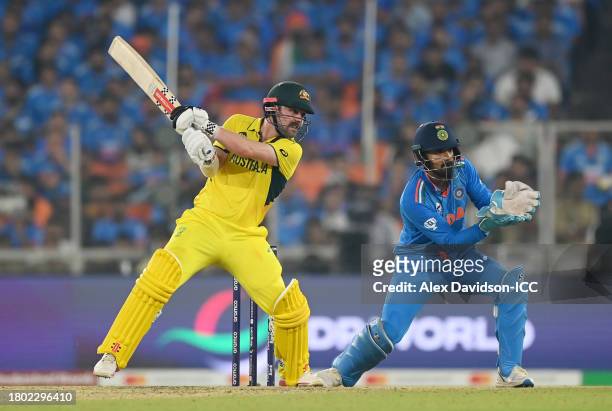 Travis Head of Australia plays a shot as KL Rahul of India keeps during the ICC Men's Cricket World Cup India 2023 Final between India and Australia...