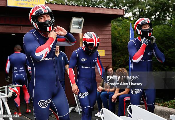 Bruce Tasker, Craig Pickering and Stuart Benson of the Great Britain bobsleigh squad prepare for a training run down the bobsleigh push track at Bath...