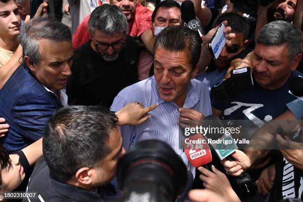 Presidential candidate for Union Por La Patria Sergio Massa greets to supporters upon his arrival to vote during the presidential runoff at Escuela...