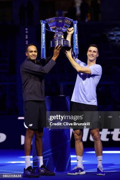 Rajeev Ram of United States and Joe Salisbury of Great Britain lift the Nitto ATP Men's Doubles Trophy following their victory in the Men's Doubles...