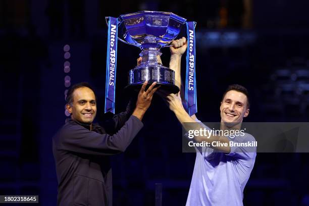 Rajeev Ram of United States and Joe Salisbury of Great Britain lift the Nitto ATP Men's Doubles Trophy following their victory in the Men's Doubles...