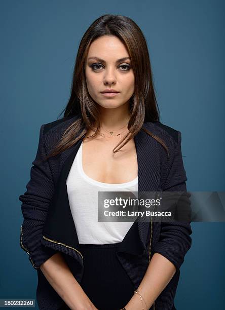 Actress Mila Kunis of 'Third Person' poses at the Guess Portrait Studio during 2013 Toronto International Film Festival on September 10, 2013 in...