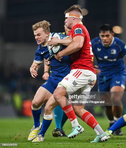 Dublin , Ireland - 25 November 2023; Ben Murphy of Leinster is tackled by Alex Kendellen of Munster during the United Rugby Championship match...