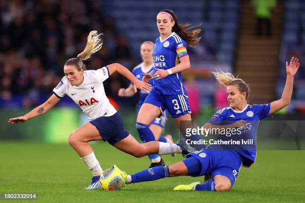 Grace Clinton of Tottenham Hotspur is challenged by Lena Petermann of Leicester City during the Barclays Women´s Super League match between Leicester...