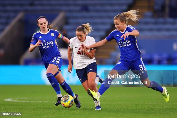 Grace Clinton of Tottenham Hotspur is put under pressure by Sam Tierney and Lena Petermann of Leicester City during the Barclays Women´s Super League...