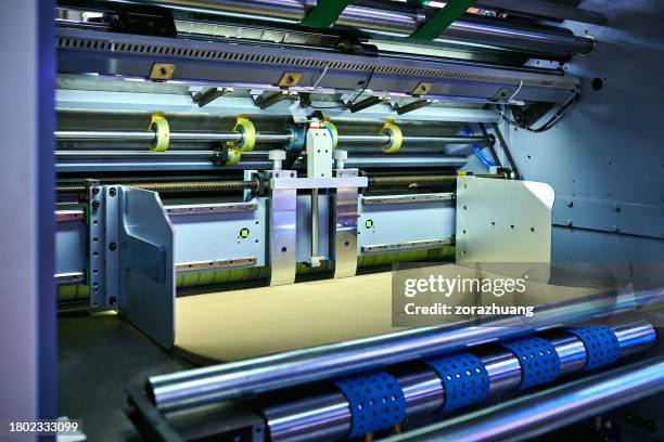 paper feeding at printing press - empurrar atividade física imagens e fotografias de stock