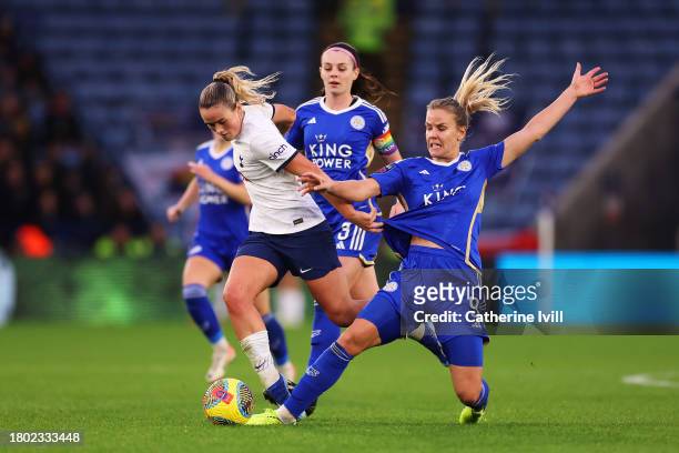 Grace Clinton of Tottenham Hotspur is challenged by Lena Petermann of Leicester City during the Barclays Women´s Super League match between Leicester...