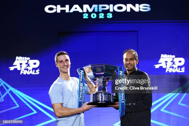 Joe Salisbury of Great Britain and Rajeev Ram of United States lift the Nitto ATP Men's Doubles Trophy following their victory in the Men's Doubles...