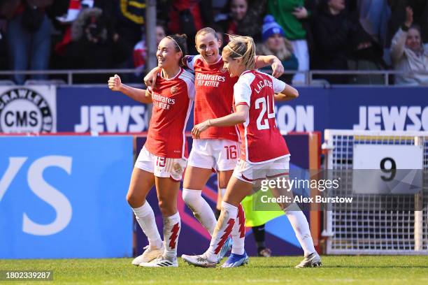 Caitlin Foord of Arsenal celebrates with teammates Noelle Maritz and Cloe Lacasse after scoring the team's second goal during the Barclays Women´s...