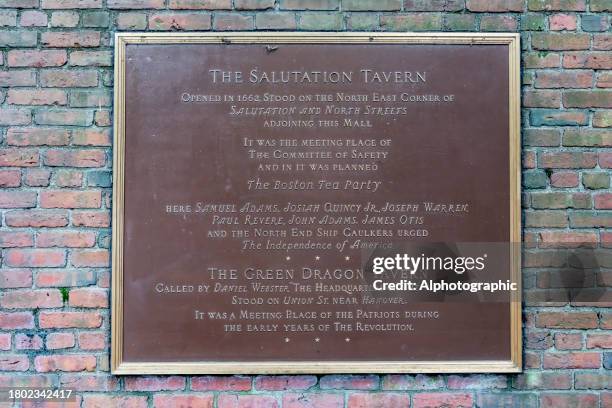 sign on the wall of paul revere's mall beside old north church, this sign gives details of the salutation tavern where the boston tea party was planned in boston - boston tea party stock pictures, royalty-free photos & images