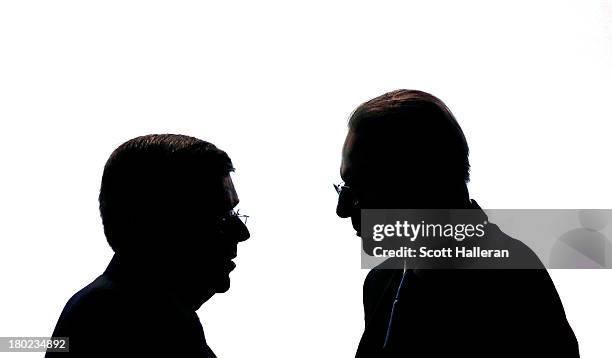 President of the IOC Jacques Rogge talks to the newly appointed ninth IOC President, Thomas Bach as he makes his Closing Speech during the 125th IOC...