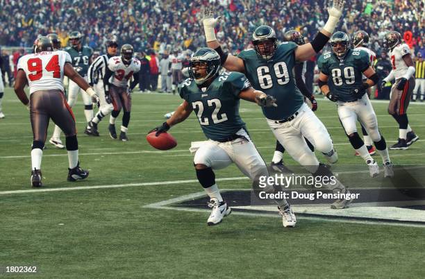Running back Duce Staley of the Philadelphia Eagles scores the first touchdown of the NFC Championship game against the Tampa Bay Buccanneers at...