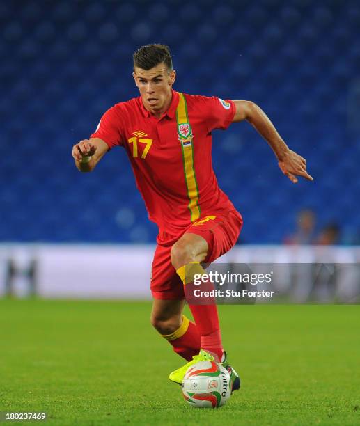 Wales player Gareth Bale in action during the FIFA 2014 World Cup Qualifier Group A match between Wales and Serbia at Cardiff City Stadium on...