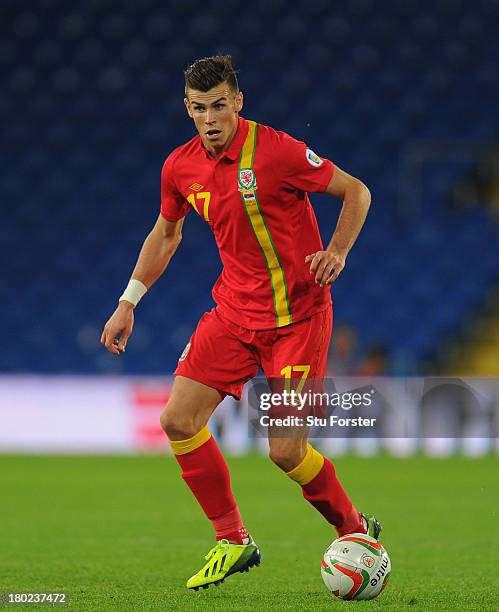 Wales player Gareth Bale in action during the FIFA 2014 World Cup Qualifier Group A match between Wales and Serbia at Cardiff City Stadium on...