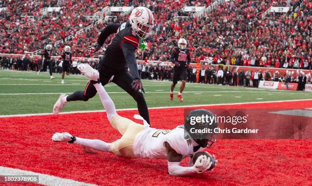 Hunter Travis of the Colorado Buffaloes can't hold on to a pass in the endzone as he is covered by Zemaiah Vaughn of the Utah Utes during the first...