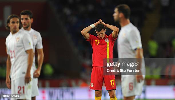 Wales player Gareth Bale reacts during the FIFA 2014 World Cup Qualifier Group A match between Wales and Serbia at Cardiff City Stadium on September...