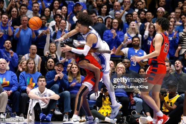 Tyrese Proctor of the Duke Blue Devils is fouled by Javius Moore of the Southern Indiana Screaming Eagles during the game at Cameron Indoor Stadium...