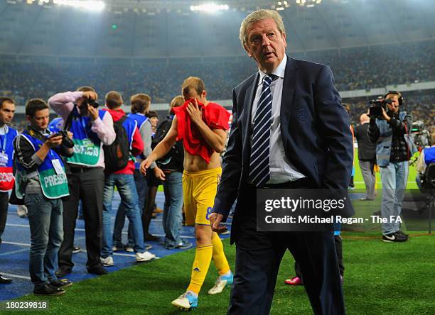 England manager Roy Hodgson looks on as Roman Zozulya of Ukraine looks dejected after the FIFA 2014 World Cup qualifier at the Olympic Stadium on...