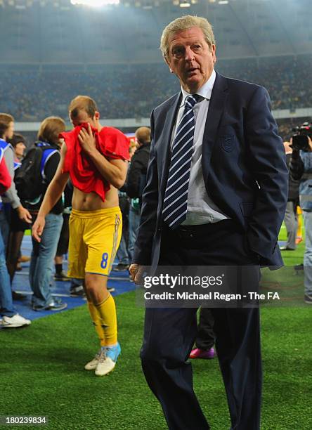 England manager Roy Hodgson looks on as Roman Zozulya of Ukraine looks dejected after the FIFA 2014 World Cup qualifier at the Olympic Stadium on...