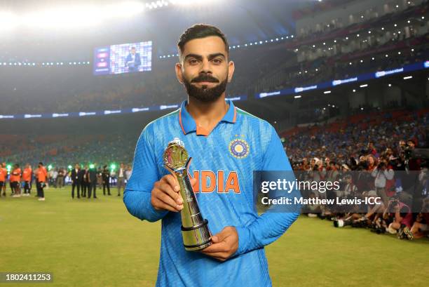 Virat Kohli of India poses after being named Player of the Tournament following the ICC Men's Cricket World Cup India 2023 Final between India and...