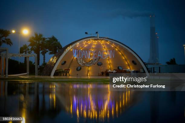 An illuminated tribute to those killed, injured and traumatised at the Nova music festival adorns Kochav HaYam complex on November 19, 2023 in...
