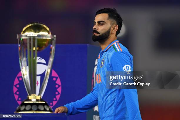 Virat Kohli of India makes their way past the ICC Men's Cricket World Cup Trophy following the ICC Men's Cricket World Cup India 2023 Final between...