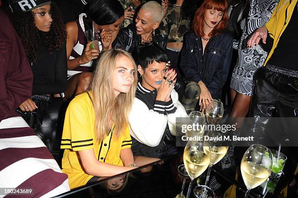 Cara Delevingne and Rihanna attends a photocall to launch to Rihanna for River Island SS14 collection on September 10, 2013 in London, England.